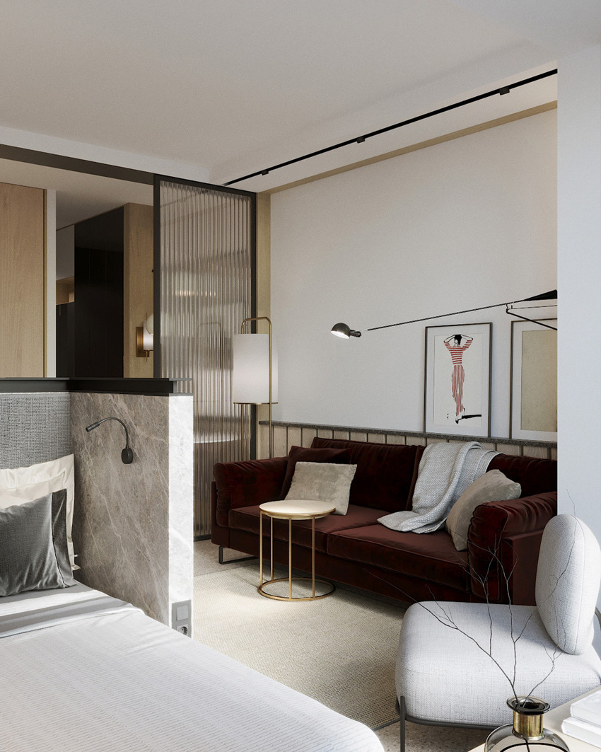 Нестандартная организация пространства прямоугольной студии с проходным санузлом.